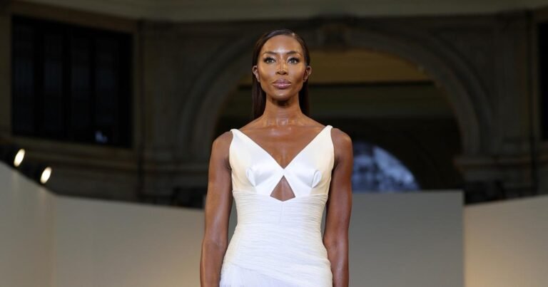 Stunning in a wedding dress, Naomi Campbell walks the catwalk at Milan Fashion Week